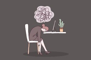Ilustración de una mujer agotada con la cabeza apoyada en la mesa de trabajo y una nube de pensamientos enredados